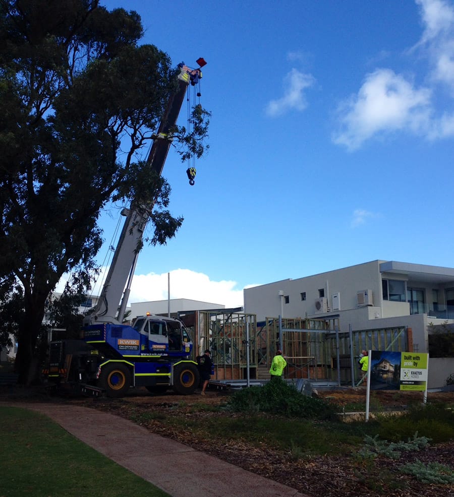 The steel beams for the second storey are carefully put in place with the close supervision of Exactus Homes Registered Builder, Ralph Brewer.