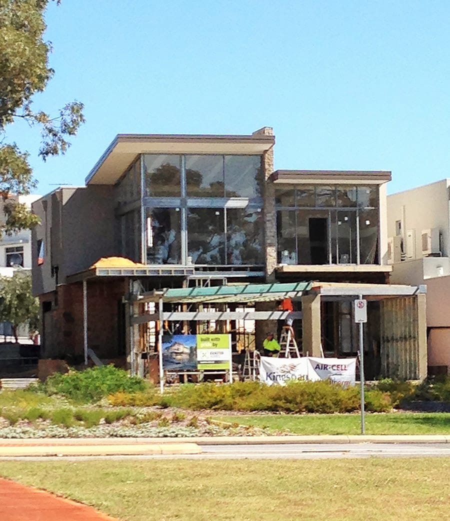 With walls and cladding almost complete, windows are installed in the new home.